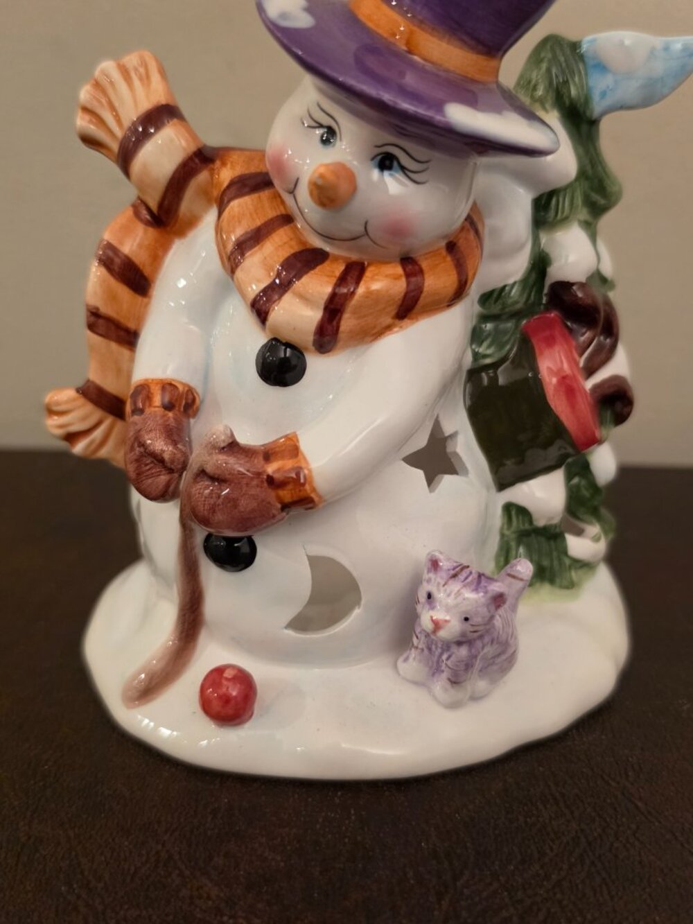 Ceramic Snowman Tealight Holder is a charming addition to your Christmas decor.